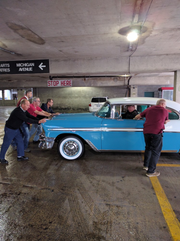 56-chevy-being-pushed-in-its-parking-spot
